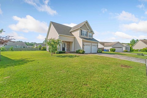 a house with a lawn in front of it