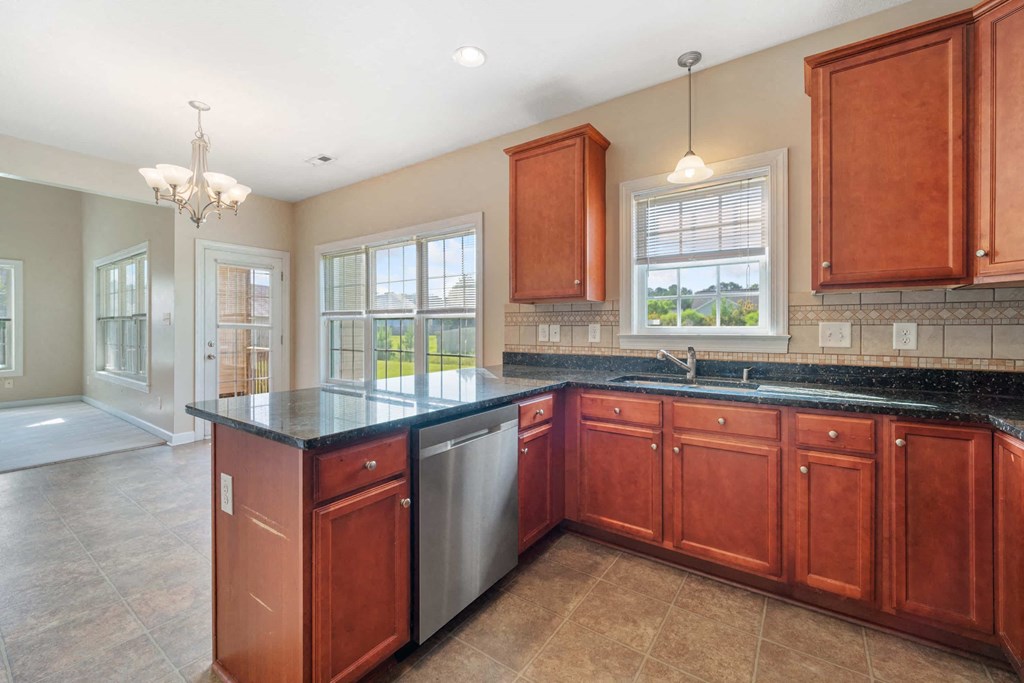 a kitchen with wooden cabinets and a counter top