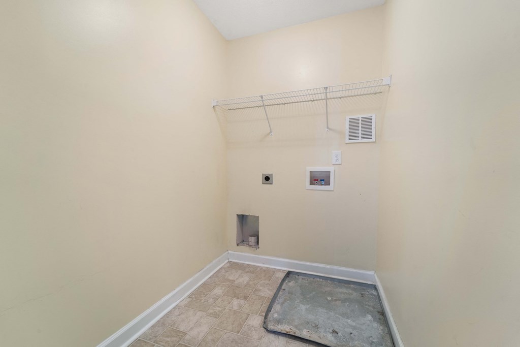 a room with an empty closet and an air conditioner on the wall