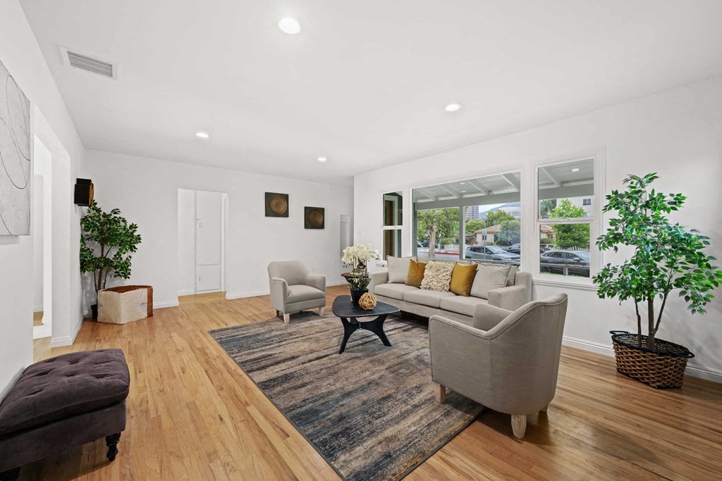 a living room with furniture and a large window