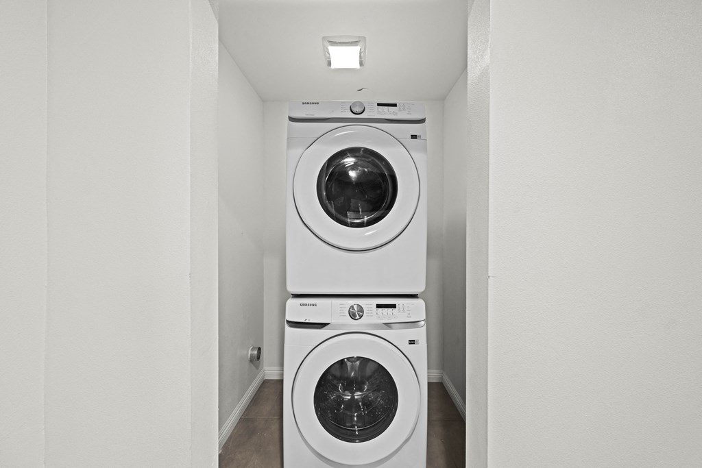 a white washer and dryer in a laundry room