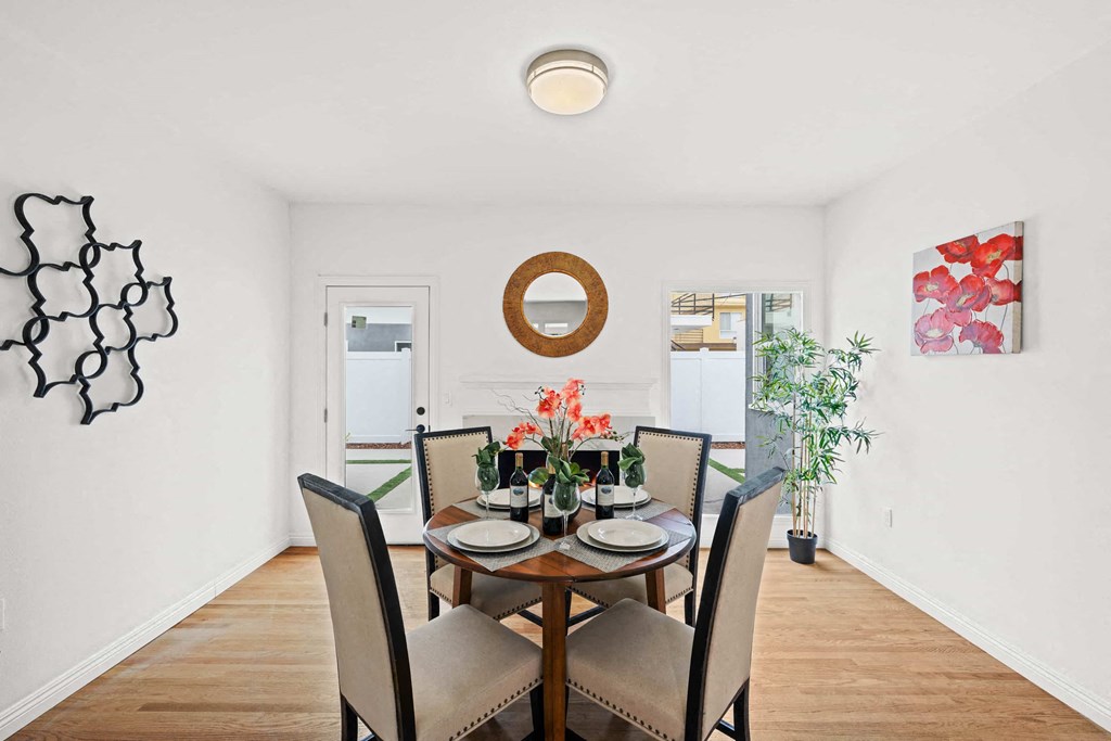 a dining room with a table and chairs