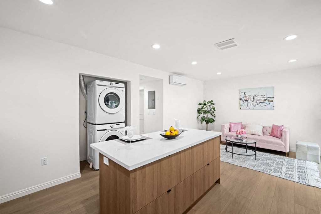 a kitchen with a counter top and a washing machine