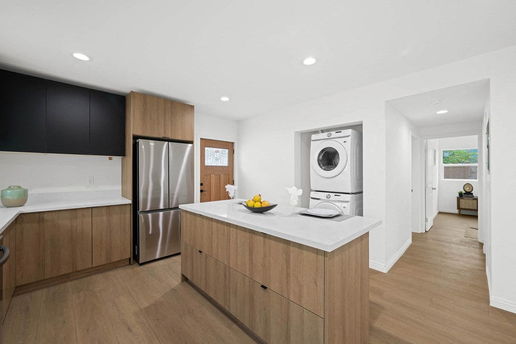a kitchen with a counter top and a washing machine