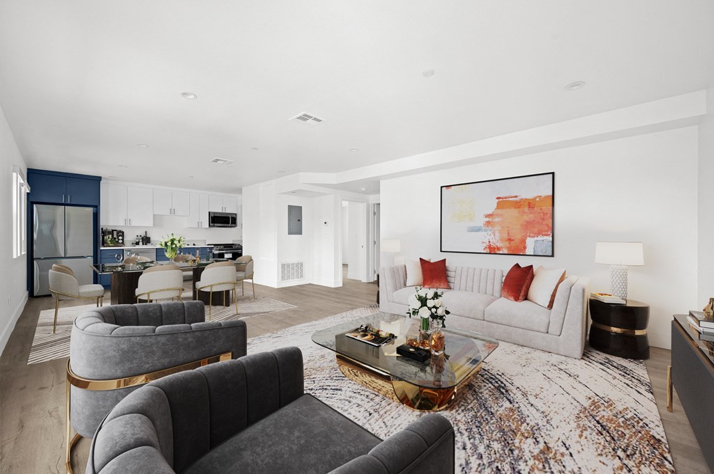 a living room with couches and chairs and a table