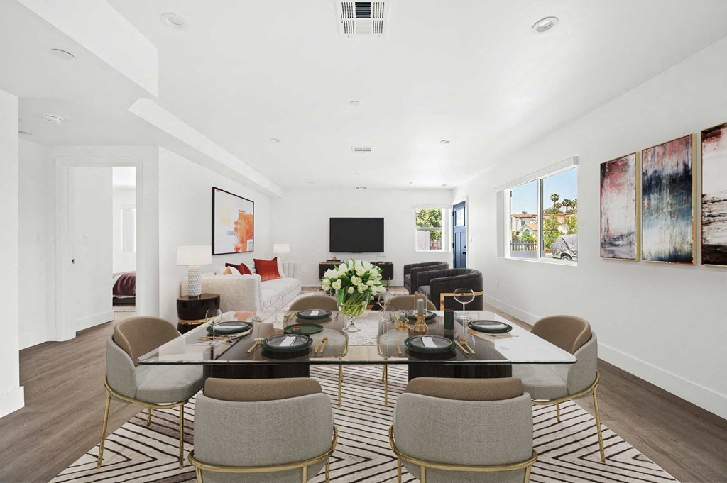 a living room with a table and chairs and a couch