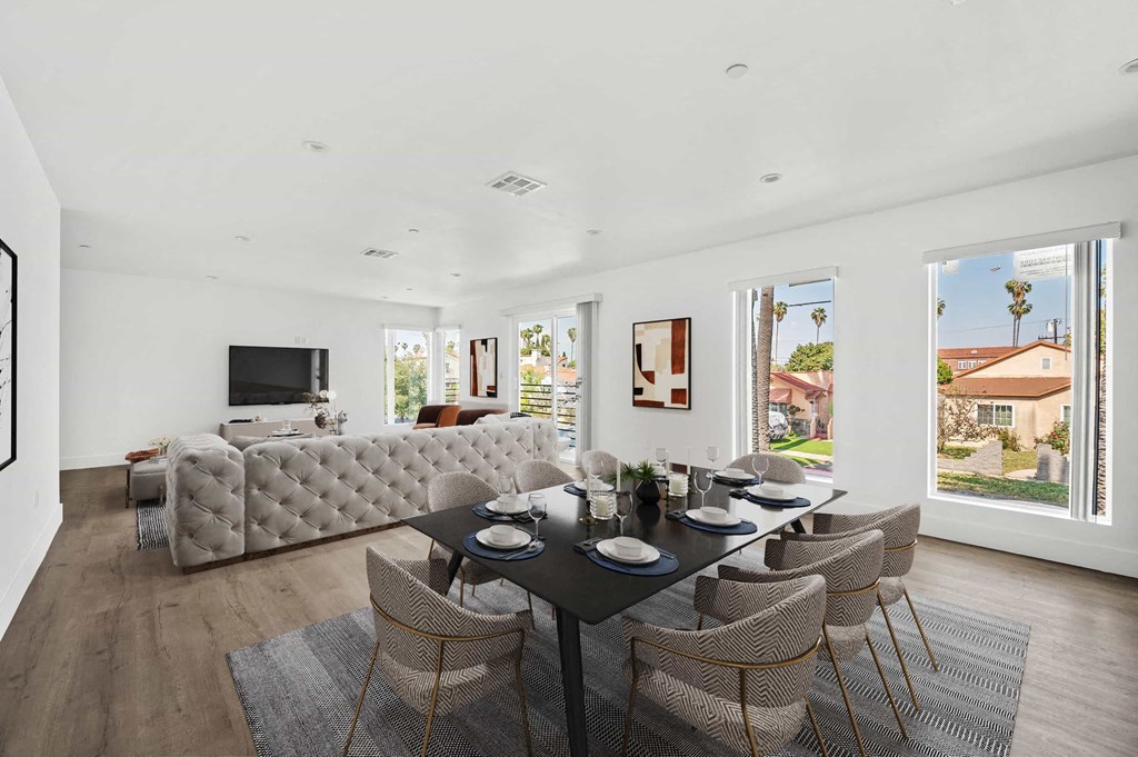 a living room with a couch and a table with chairs