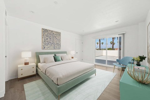 a bedroom with a large bed and a window