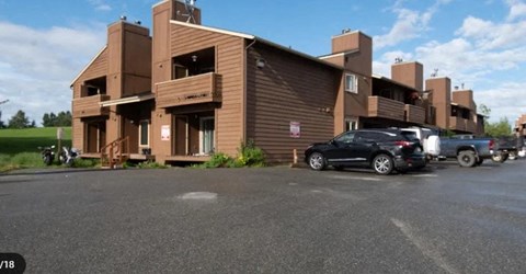 a building with cars parked in front of it