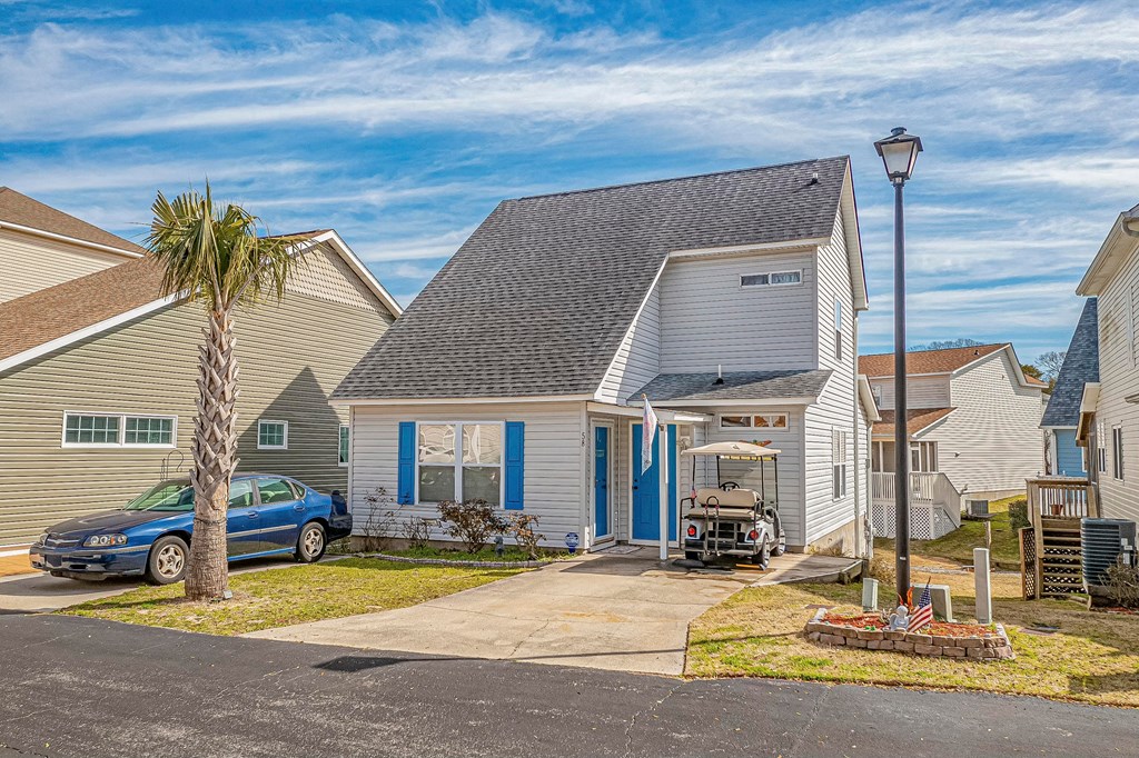 a house with a car parked outside of it