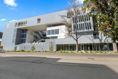 A modern building with a white facade and large windows.