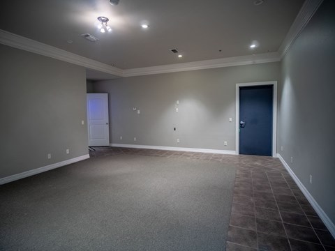 a empty living room with a blue door
