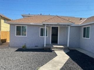 a white house with a porch and a pathway