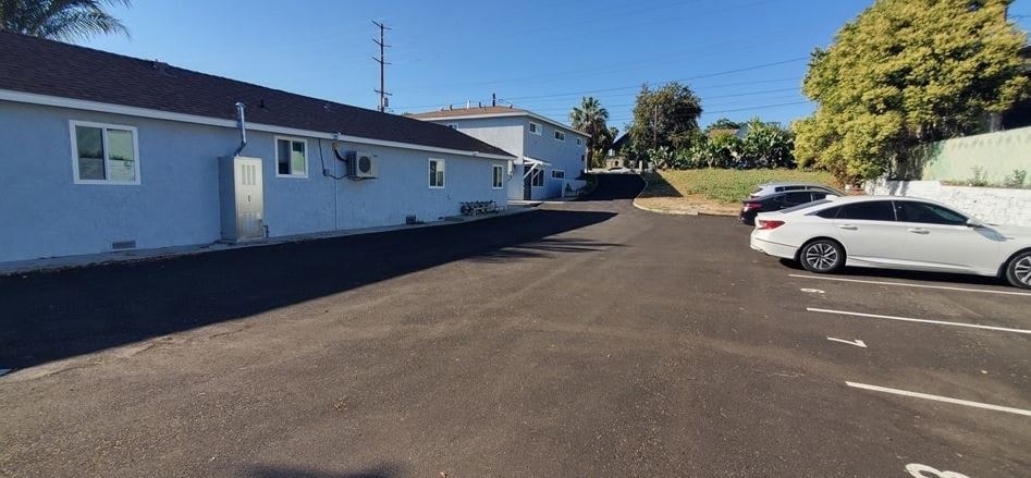 a white car parked on the side of a street