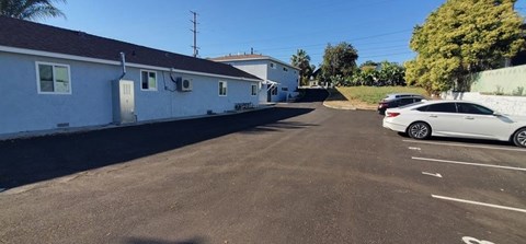 a white car parked on the side of a street