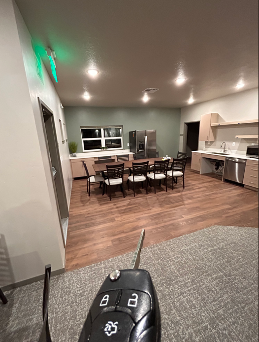 a view of a living room and dining room from a remote control