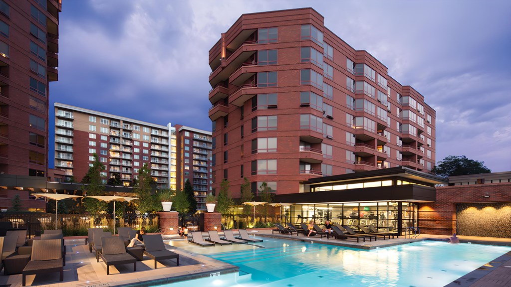 a swimming pool at a hotel in front of a building