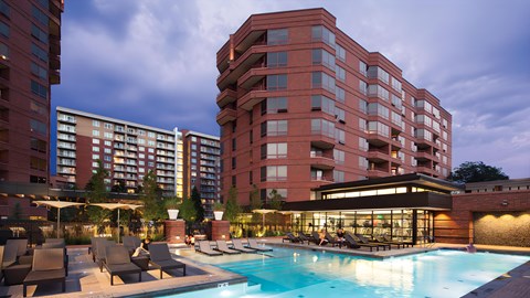 a swimming pool at a hotel in front of a building