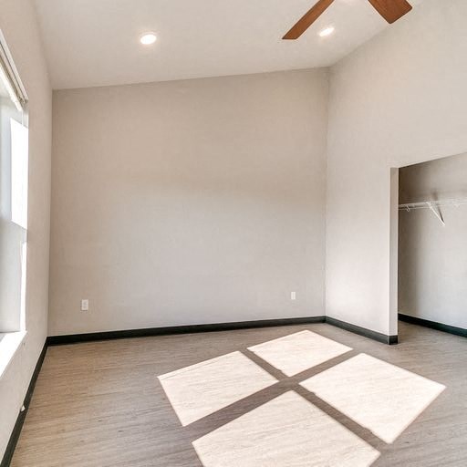 a empty room with a rug on the floor