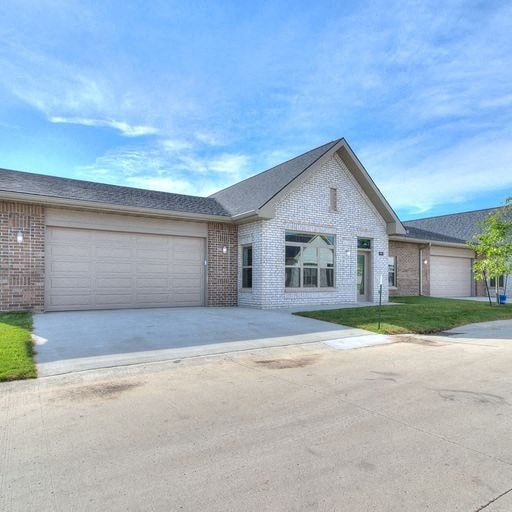 a house with a driveway and a garage door