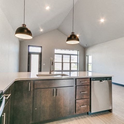 a kitchen with a sink and a counter top