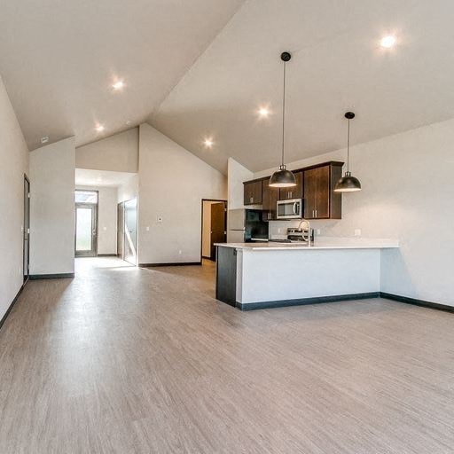 an empty kitchen and living room with a white