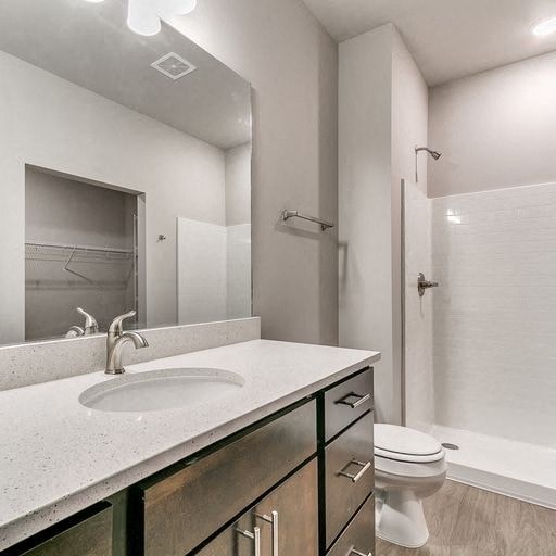 a bathroom with a sink and a toilet and a mirror