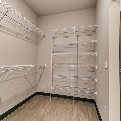 a empty room with white shelves in it
