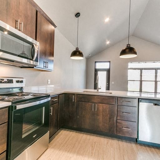 a kitchen with a stove and a microwave