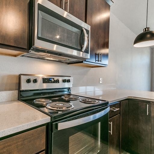 a kitchen with a stove and a microwave