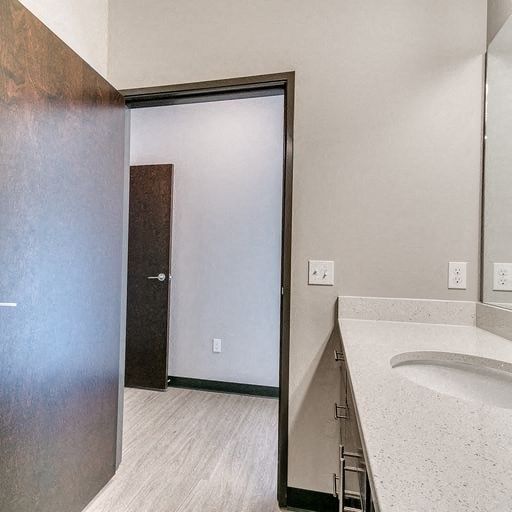 a bathroom with a sink and a sliding glass door