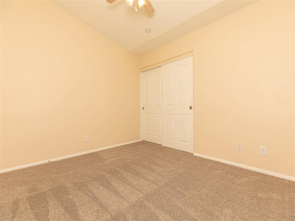 a room with carpet and a door