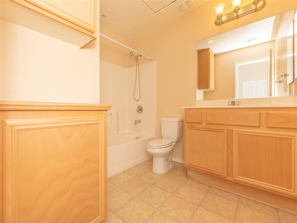 a bathroom with a toilet and a sink