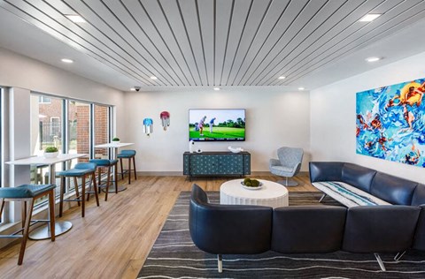 a living room filled with furniture and a tv