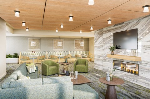 a living room with couches and chairs and a fireplace