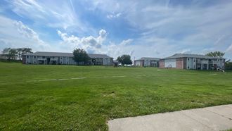 our apartments are located in the middle of a large grass field
