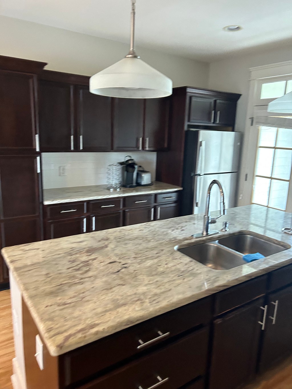 a view of a kitchen with a sink and a counter top