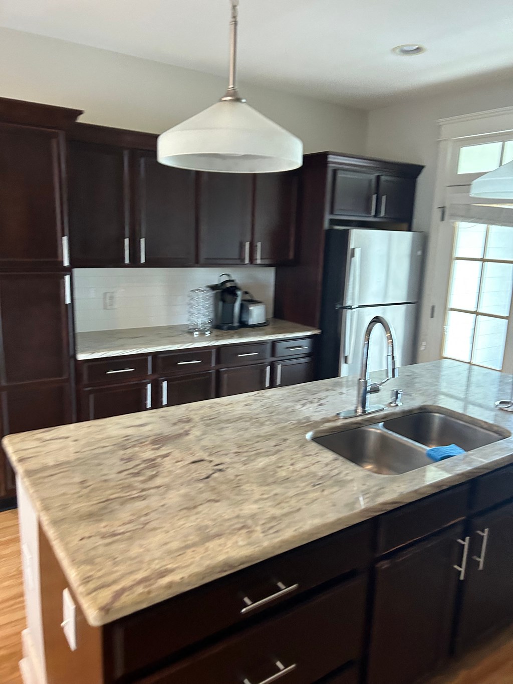 a view of a kitchen with a sink and a counter top