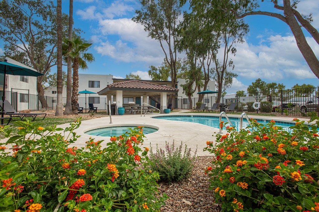 our apartments have a swimming pool and a garden with flowers