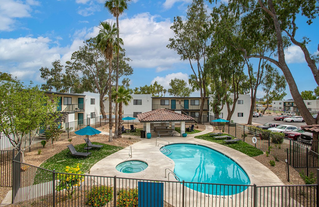 our apartments have a swimming pool and a patio with umbrellas