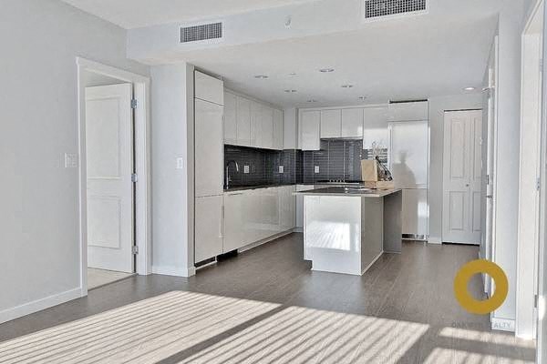 a large white kitchen with a white