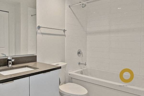 a bathroom with a sink toilet and a bath tub