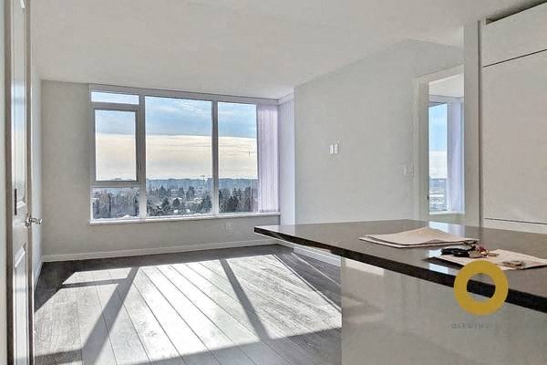 a living room with a large window and a table