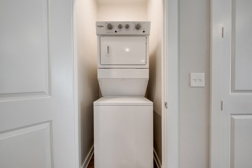 the residence apartment laundry room with washer and dryer