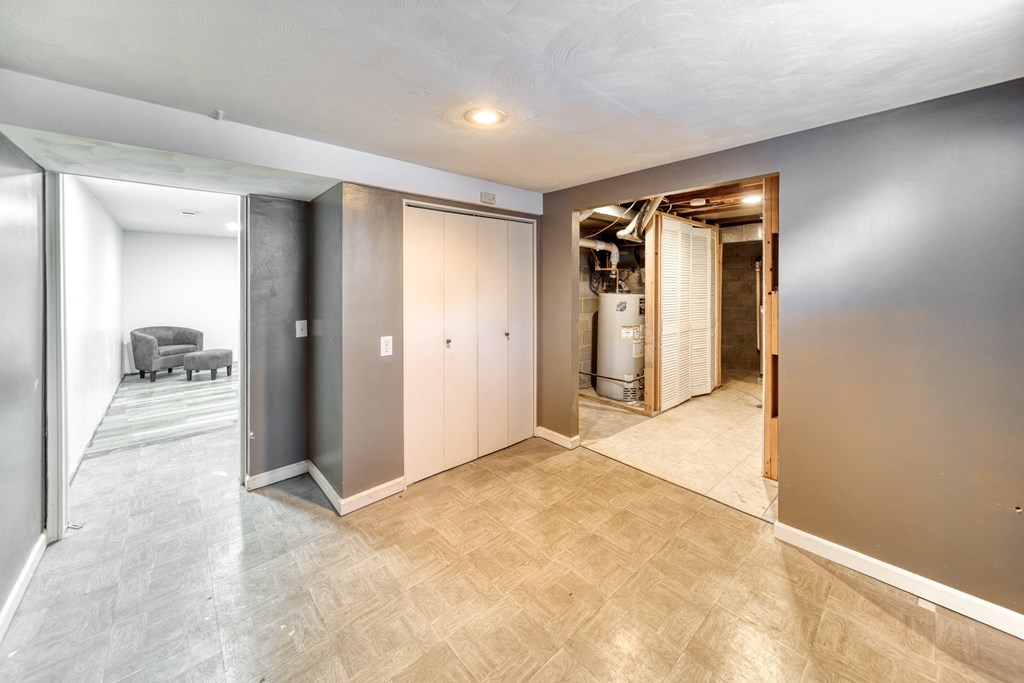 a renovated living room with a hallway and a kitchen