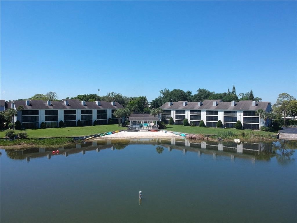 a large body of water in front of an apartment building