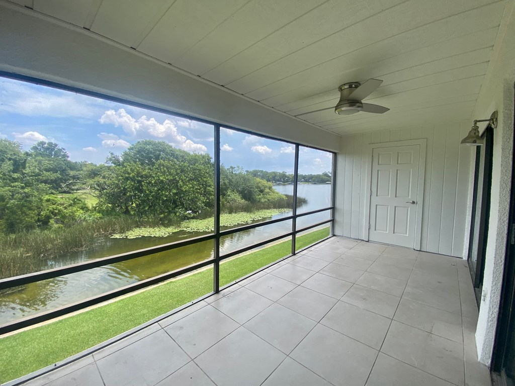 a view of the river from the screened porch of a home