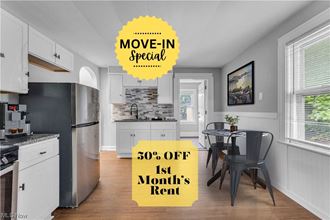 move in specials in a kitchen with a table and a refrigerator