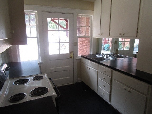 a small kitchen with a stove and a sink