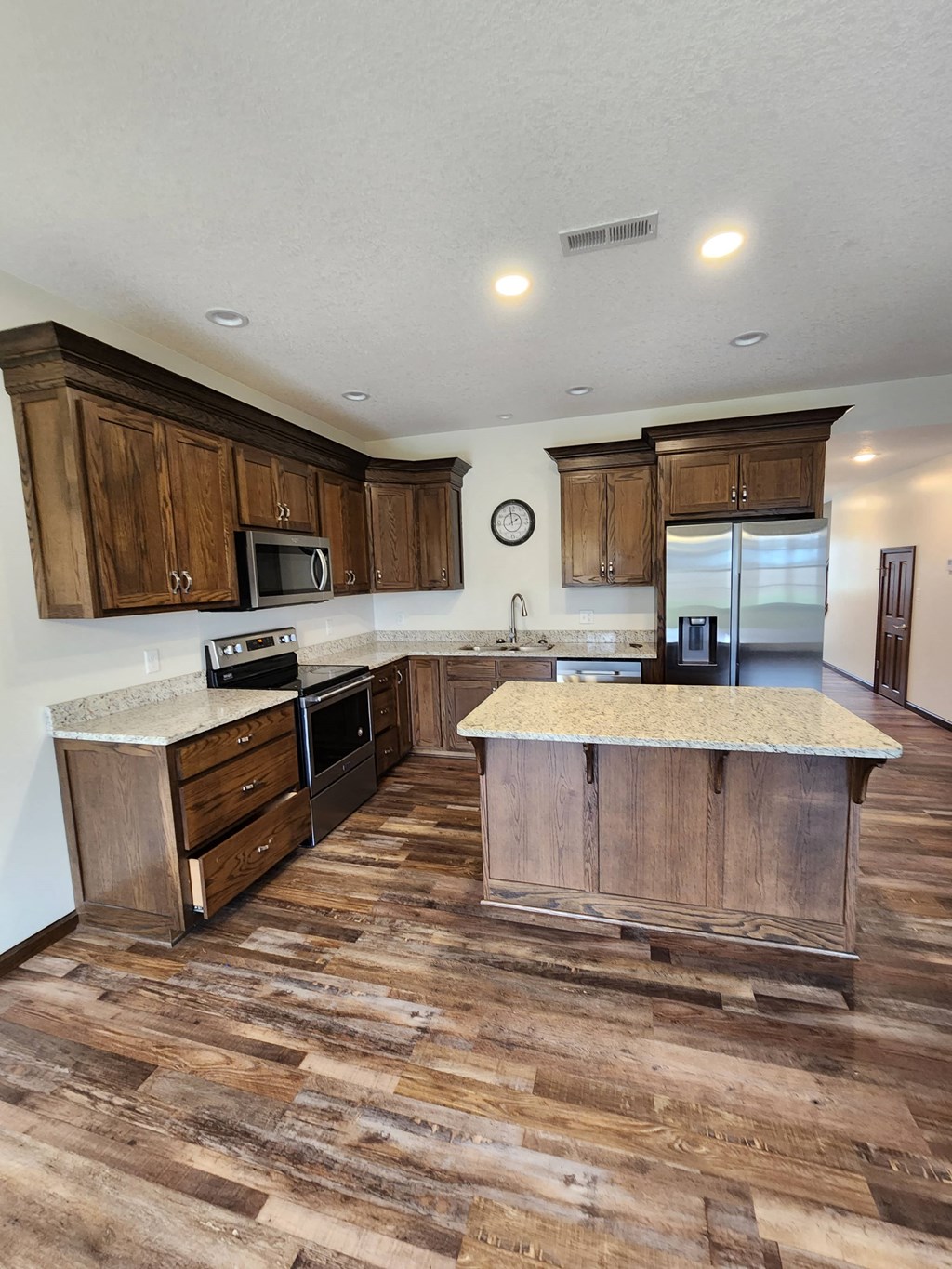 a kitchen with wooden cabinets and a counter top